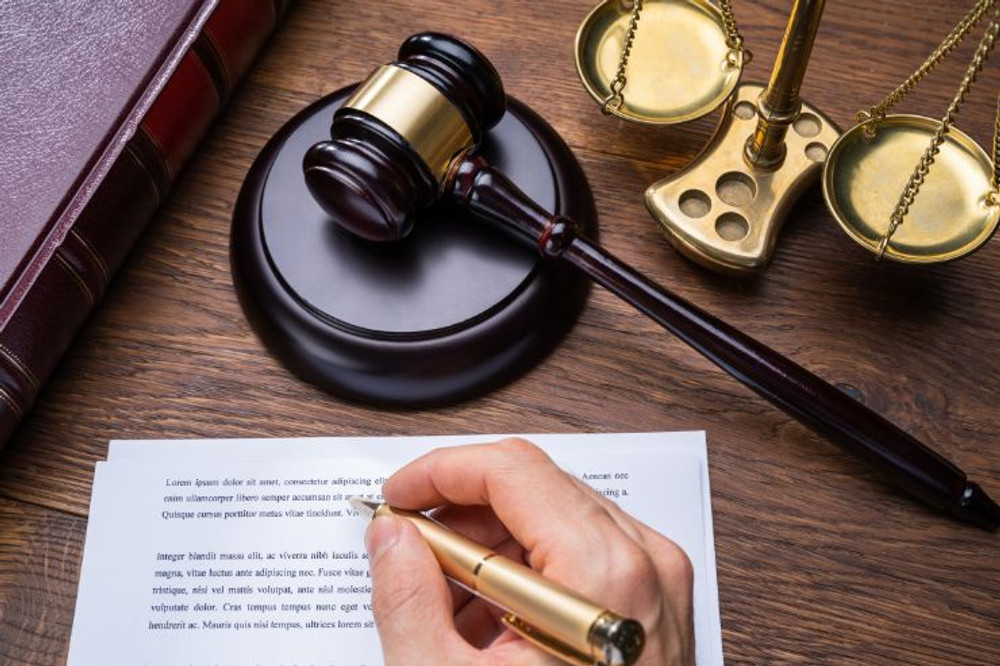 signature on paperwork for real estate